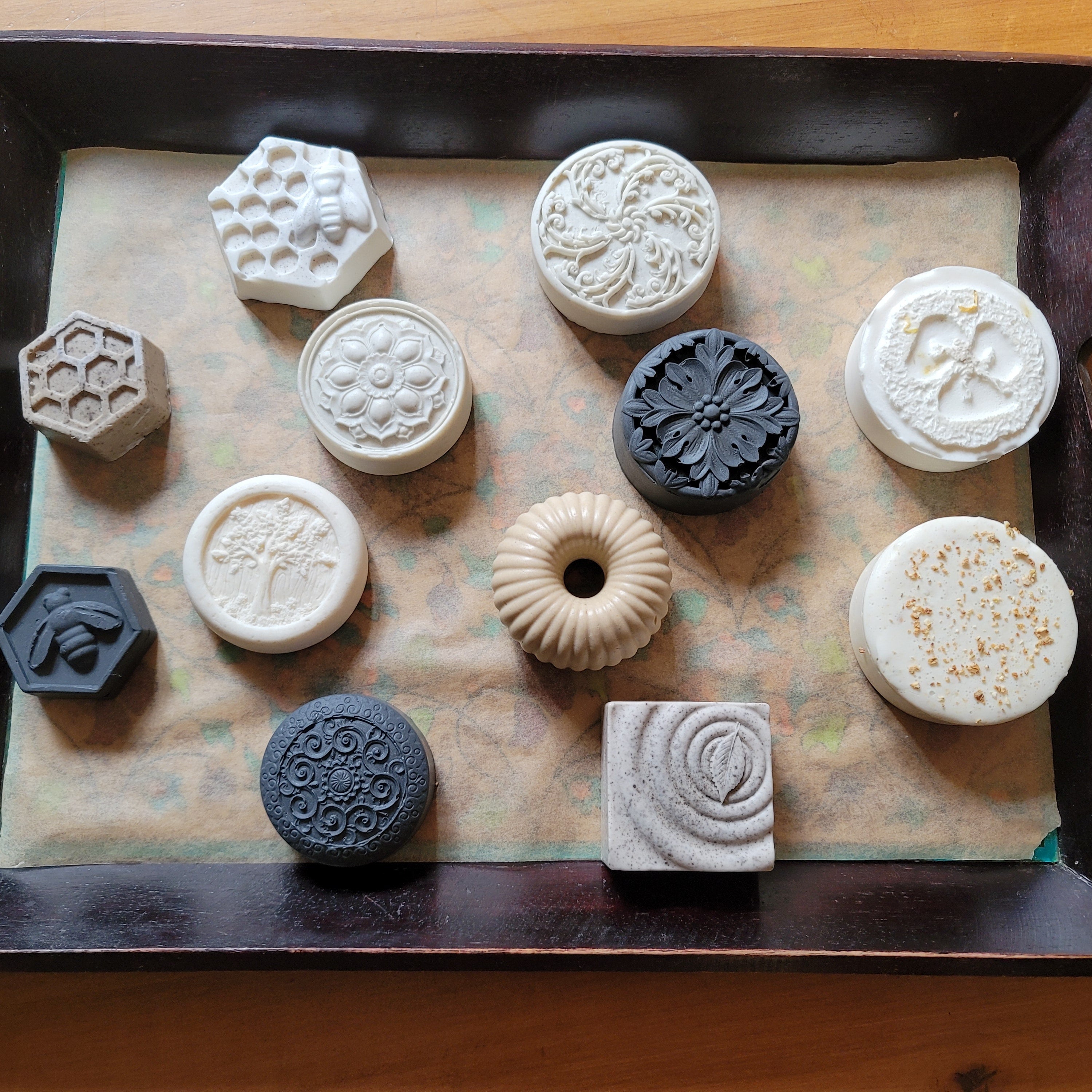 a picture of an assortment of soap varieties on a tray