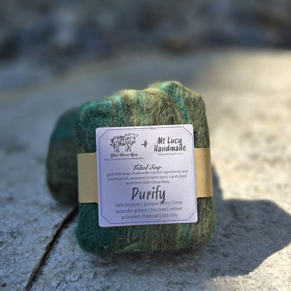 purify square soap with dark green felt and white label on a slate background